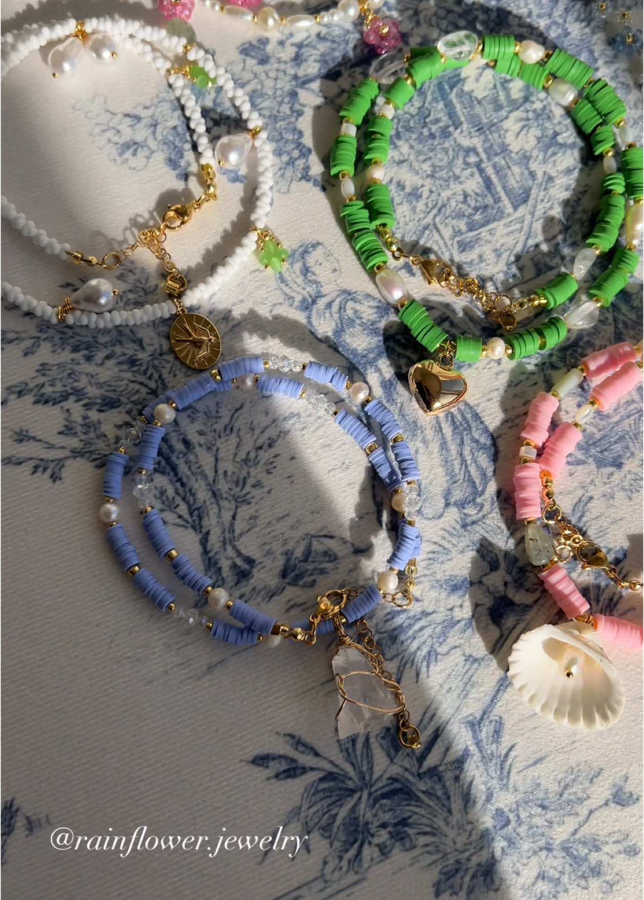 A post by @rainflower.jewelry on TikTok caption: Three new vibrant necklaces just dropped — made with water-resistant materials, even safe for the sea🐚 I think they’d look perfect with a swimsuit, and yes, you can totally swim in them without worry🌊 Now available on my website with free worldwide shipping! (Link in bio)💫 #waterproofjewelry #beachnecklace #handmadeaccessories #summervibes #vacationstyle #swimfriendly #oceanready #colorfuljewelry #aestheticaccessories #beadednecklace #beachwear #bohobeach #travelessentials #shopsmallbusiness #supporthandmade #fyp #trendyjewelry #viralfinds #freeworldwideshipping 