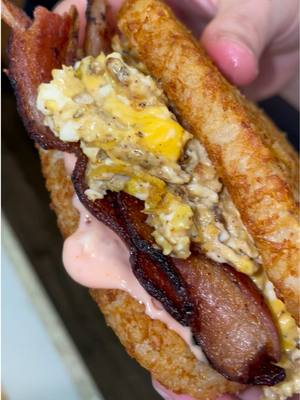 A post by @grubspot on TikTok caption: Make a quick bfast w/ me #grubspot #hashbrowns #egg #bacon #cheese #foodtiktok #fyp 