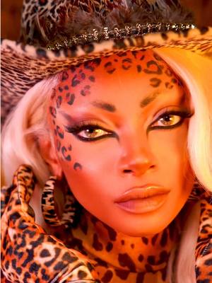 A post by @nyane on TikTok caption: A very quick “Let’s do my makeup” 🐆 in the jungle pt.2 🌿🌴🍃 What are your thoughts on the final look?  @Huda Beauty pretty grunge palette  @meltcosmetics lips  #lensme #letsdomymakeup  #foryoupage #coachella #festival  #makeup #leopardmakeup 
