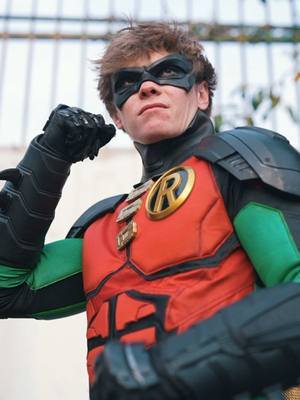 A post by @alex.stemp on TikTok caption: Robin asked for an upgrade… will he get one? #FitSwap with @watchmybluray @Raymond Weijland #DCComics #Cosplay #Batman 