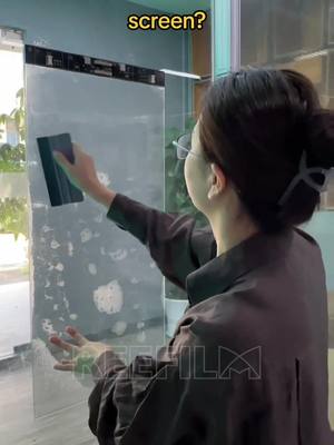 A post by @reefilm_display on TikTok caption: Reefilm LED film screen is easy to install #ledwall #glass #ledscreen #reefilm #leddisplay #hottest #transparent #install #panel #ledfilm 