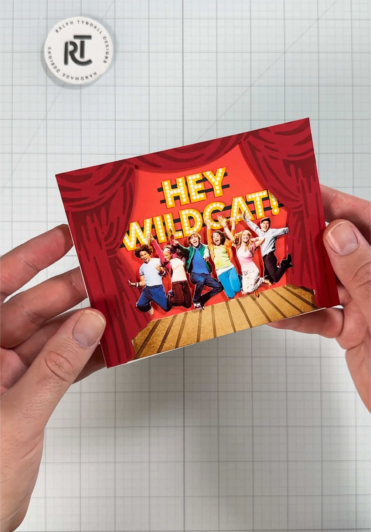 A post by @ralphtyndall on TikTok caption: Replying to @minnezb There were full blown arguments in the comments of my last video because I didn’t show how to put the speaker in the card lol. Hopefully this helps! This time we’re making a card for my all time favorite Disney Channel movie High School Musical!  #cardmaking #asmr #diy #craft #disney #hsm #highschoolmusical 