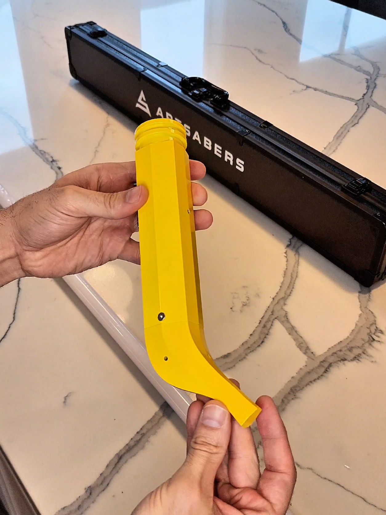 A post by @nomad.props on TikTok caption: this banana saber from @ARTSABERS is just bananas! 🍌 #unboxing #lightsaber #starwars #minions #banana 