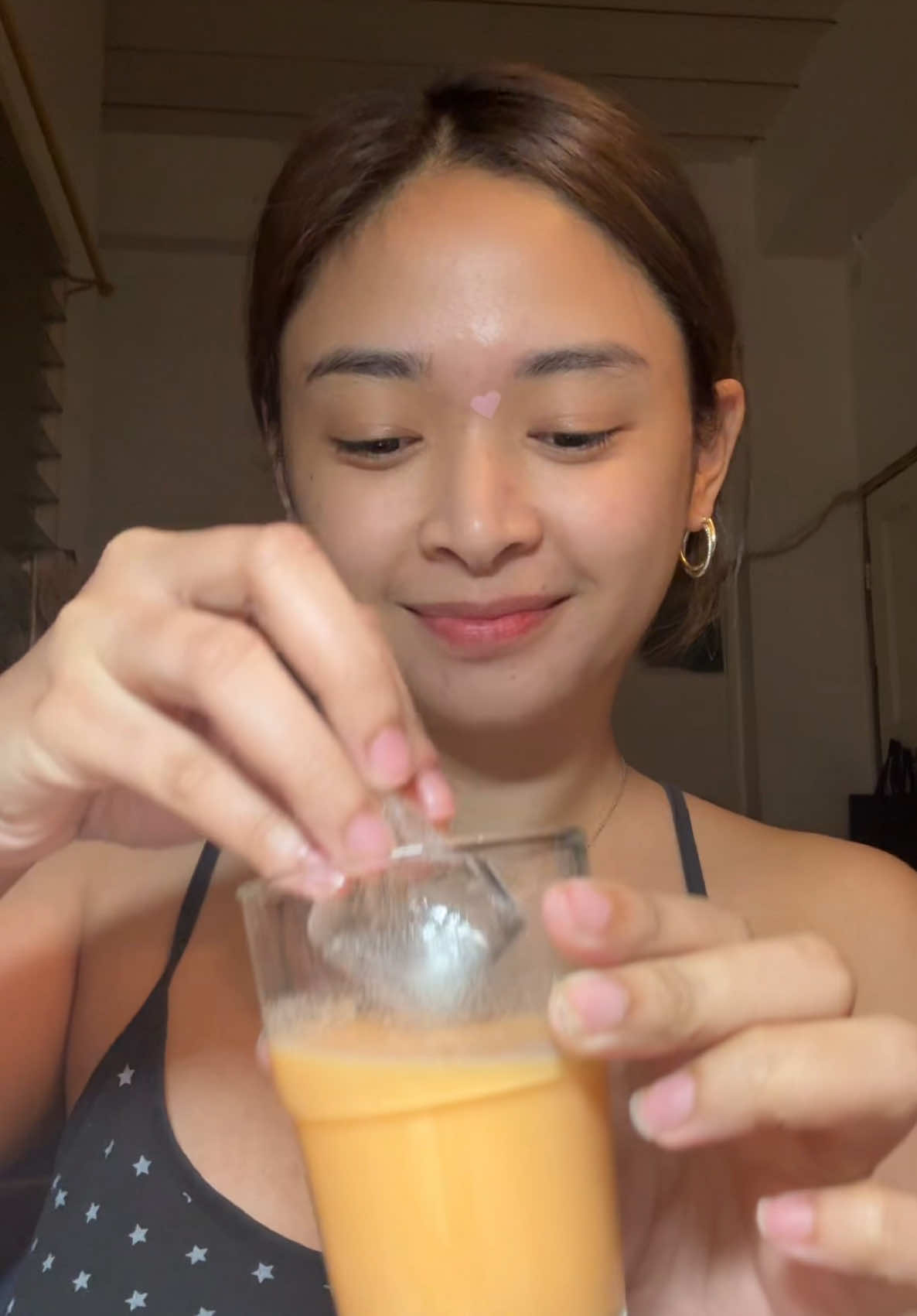 A post by @nikkivelayo on TikTok caption: POV: it’s your 15th day of drinking @S and J Beauty Main 😋