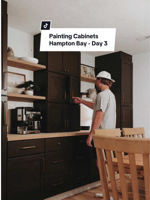A post by @drewpow on TikTok caption: Did we make the right choice by painting it? The cabinets are Hampton Bay RTA cabinets from Home Depot for everyone asking!