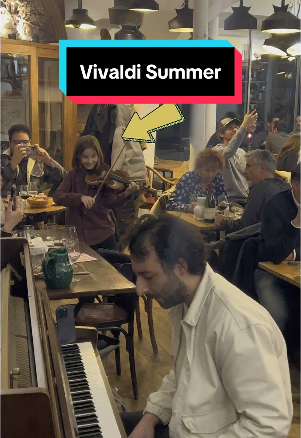 A post by @juliencohen_piano on TikTok caption: 10 year-old violin PRODIGY joined me to play Vivaldi Summer in a restaurant in Paris. His skill is just amazing 😱 #vivaldifourseasons #vivaldisummer #vivaldi #childprodigy 
