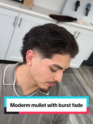 A post by @ivanthegreat86 on TikTok caption: Big transformation 🥱 check this modern mullet with a low burst fade #dallasbarber #menshairstyle #Texasbarber #straighthair #hairtransformation #barberconsultation 