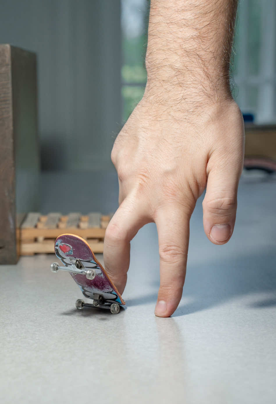A post by @stonedboarder on TikTok caption: Quick hit 🎯 #fingerboarding #fingerboard #fingerboards #skatelife #fingerskate #fyp #fingerboardtricks #skaters #techdeck #skateclips #sk8 