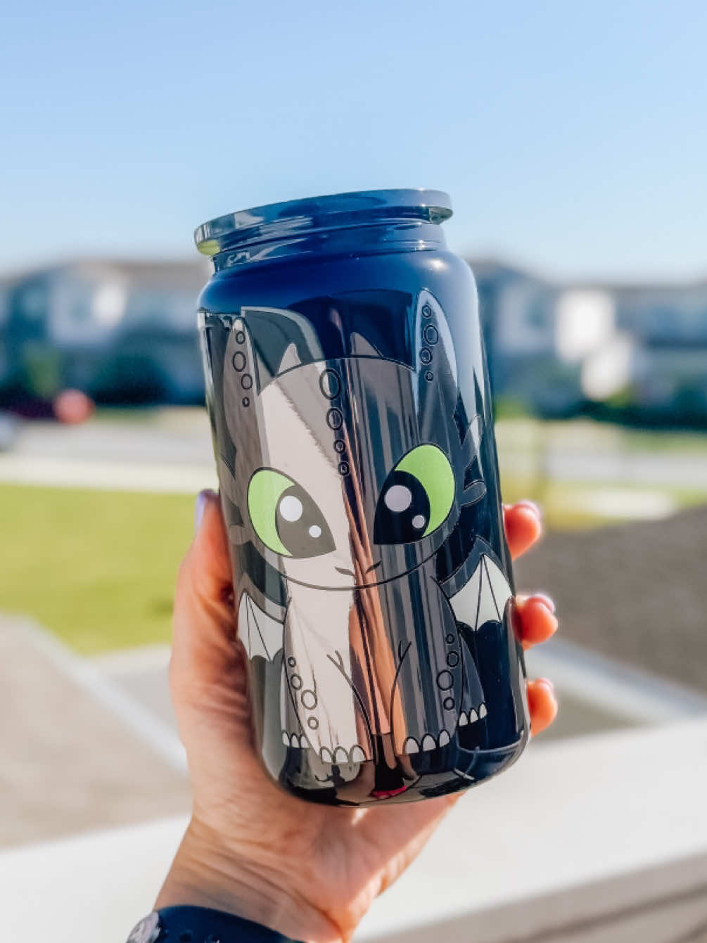 A post by @threepairsofears on TikTok caption: Replying to @awholeassbish Let’s make a Toothless cup using permanent adhesive vinyl! 🖤 Has anyone else seen 1 million videos of  Toothless is at Epic Universe? He’s so dang cute! … #s#smallshops#smallshopss#smallbusiness#t#threepairsofearsa#asmra#asmrvideoc#cricutm#makerc#cricutmaker#c#craftingc#craftsd#diyc#crafterc#customcups#customcupp#permanentadhesivevinylc#craftvinylt#toothlessh#howtotrainyourdragonH#HTTYDe#epicuniverseuniversalstudios 