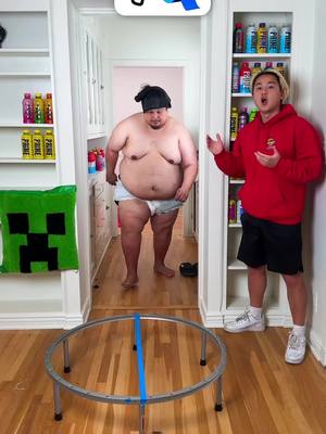 A post by @zhong on TikTok caption: how many tape does it take to hold a sumo wrestler?