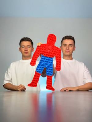 A post by @twinsstylee on TikTok caption: We made our own DUBAI CHOCOLATE but in SPIDERMAN POP-IT 🍫💚🕷️🕸️ COME BACK here in 24h 🍫 💚