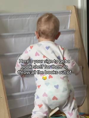 A post by @ttc.with.sarandipiti on TikTok caption: This phase is fun 🤩  #bookshelf #toddlersoftiktok #toddlermom #toddlerbooks 