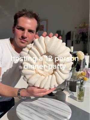 A post by @ryannordheimer on TikTok caption: 12 person dinner party 🌸 comment “recipe” and I’ll send it to you. recipes are also below.  glazed carrots 🥕 1. In a large pan, add 4 tbsp butter, 2 tbsp maple syrup, carrots, 1/2 cup water, 1 tsp salt. Cook over medium-high heat. When simmering, cover for 15 minutes, then uncover and let sauce reduce/allow carrots to become tender. Then stir in sesame seeds and Aleppo pepper.  2. Serve with tahina.  little gems with charred lemon dressing  1. Char 1 lemon (halved) until the cut side is charred. Add to a blender with 1/4 cup lemon juice, 1/3 cup olive oil, 2 tsp dijon, 1 tsp salt, 2 tsp honey.  2. Dress little gems.  sumac potato wedges with garlic yogurt 1. Cut Yukon potatoes into wedges. Season with olive oil, salt, pepper, sumac, za’atar. Roast at 425F until golden and tender.  2. Mix 2 grated garlic, juice of half a lemon, pinch of salt into greek yogurt. Serve potatoes with the yogurt and pickled red onion.  . #ryannordheimer #recipe #viral #lamb #chicken #easychicken #privatechef #aesthetic #comfort #cookbook #comfortfood #ranch #easydinneridea #nyc #newyork #pavlova #grapefruit #protein #nycfoodie #nycfoodblogger #nycfood #creator #dinnerparty #carrots #salad #potato #spring #springrecipe #potatoes #flowers #passover

