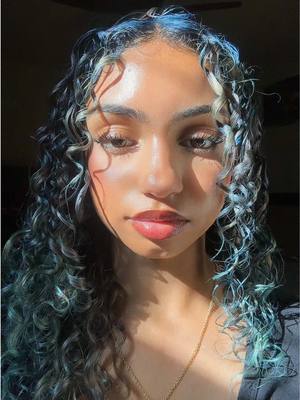 A post by @luvv4iys on TikTok caption: it’s all blue 💙 #icywicy #bluehair #curls 