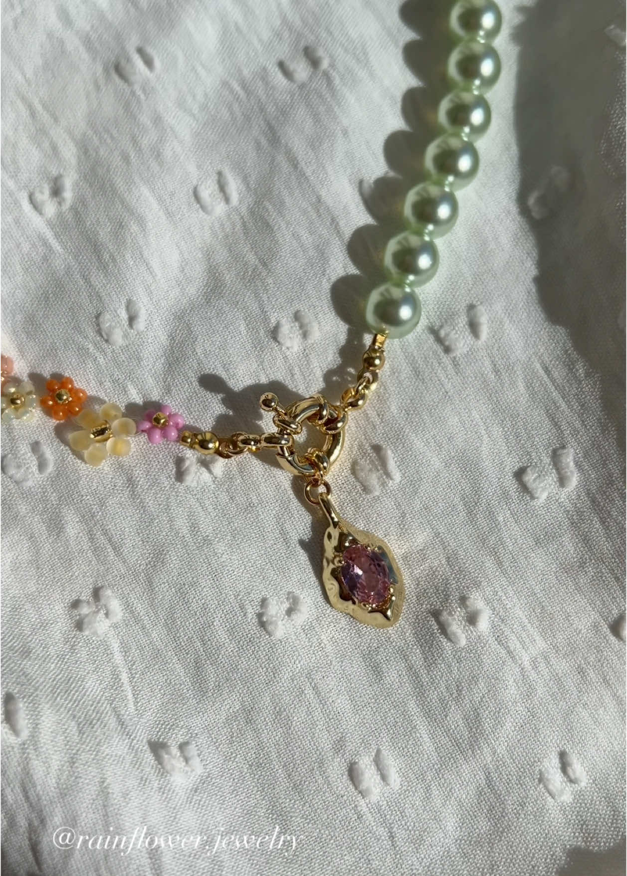 A post by @rainflower.jewelry on TikTok caption: I’m in love with this necklace and its beautiful mix of soft spring shades🌱🌸✨🧚🏽 It’s now available in my shop with free worldwide shipping — link in bio!🤍 #springjewelry #handmadenecklace #floraljewelry #pastelvibes #aestheticjewelry #beadednecklace #springaesthetic #bohochic #supporthandmade #shopsmall #trendyjewelry #cottagecorestyle #fashioninspo #daintyaccessories #fyp #viraljewelry #freeworldwideshipping 
