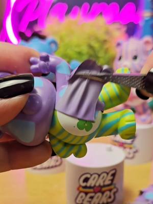 A post by @asmrplayroom on TikTok caption: CareBears Peel N Reveal Series 1&2 #asmr #carebears #peelnreveal #peeling 