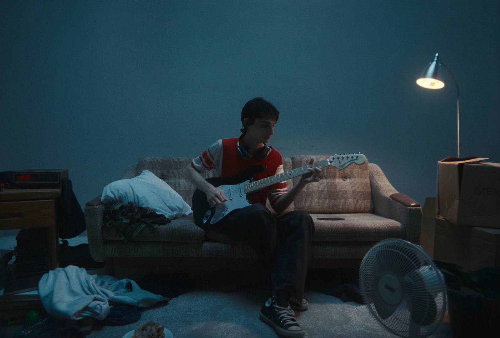 A post by @finnwolfhardofficial on TikTok caption: A few stills from the “Trailers after dark” video #newmusic 