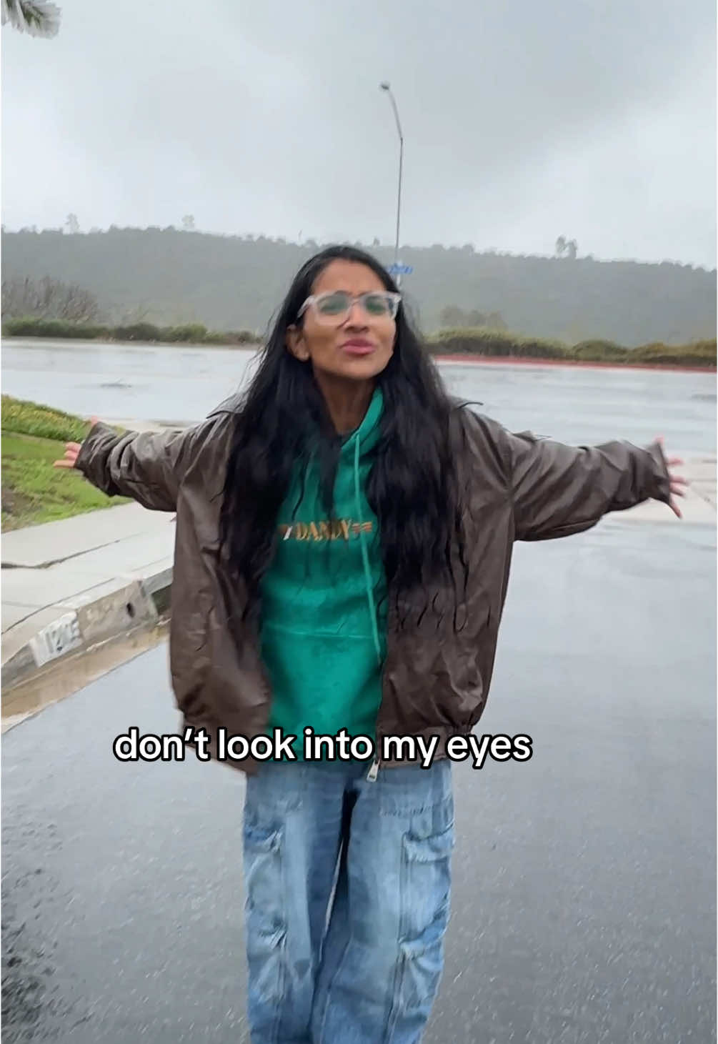 A post by @kiranandnivi on TikTok caption: New music??? i fall back down to earth #downtoearth #earthquake #newmusic #singing #rain #songwriter #fyp  