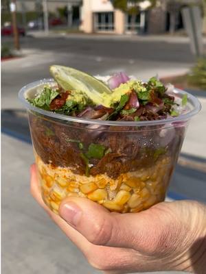 A post by @grubspot on TikTok caption: @papitacoschurros corn cups go insane #grubspot #corn #birria #cheese #elote 