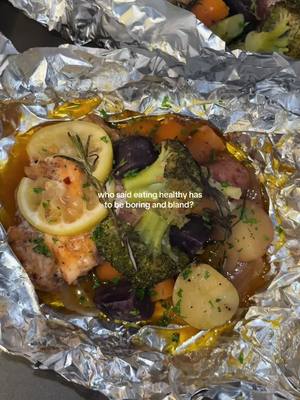A post by @papijoe242 on TikTok caption: Delicious and healthy recipes >> 😋Ingredients:  Salmon Potatoes  Broccoli  Carrots  White onion  Minced garlic  Rosemary  Unsalted butter  Aluminum foil paper  Lemon  Freshly chopped parsley  Instructions:  Pat the salmon dry and cut it into cubes. Drizzle with olive oil, then season with Kinder's The Blend seasoning, onion powder, crushed red pepper flakes, paprika, and Old Bay seasoning. Mix and allow it to marinate for about 30 minutes. While the salmon marinates, clean and chop your vegetables. In a mixing bowl, drizzle with olive oil and season with Slap Ya Mama Cajun seasoning, Kinder's The Blend seasoning, onion powder, and Morton’s Season-All. Mix thoroughly. Tear two large sheets of aluminum foil and place the seasoned salmon and vegetables in the center of each. Add lemon slices, fresh rosemary, and a few slices of unsalted butter to each packet. Fold the foil tightly to seal the packets and bake in a preheated oven at 375°F for 50 minutes. Once cooked, garnish with freshly chopped parsley and serve. Enjoy this healthy and flavorful dish! Follow for more delicious recipes. #fyp #foryoupage #cooking #cookwithme #healthymeals #healthycooking #foilpacks #easyrecipes #dinnerideas #mealideas #salmonrecipe #vegetables #foodie #foodtiktok #trending #viral #viralvideo #xyzbca 