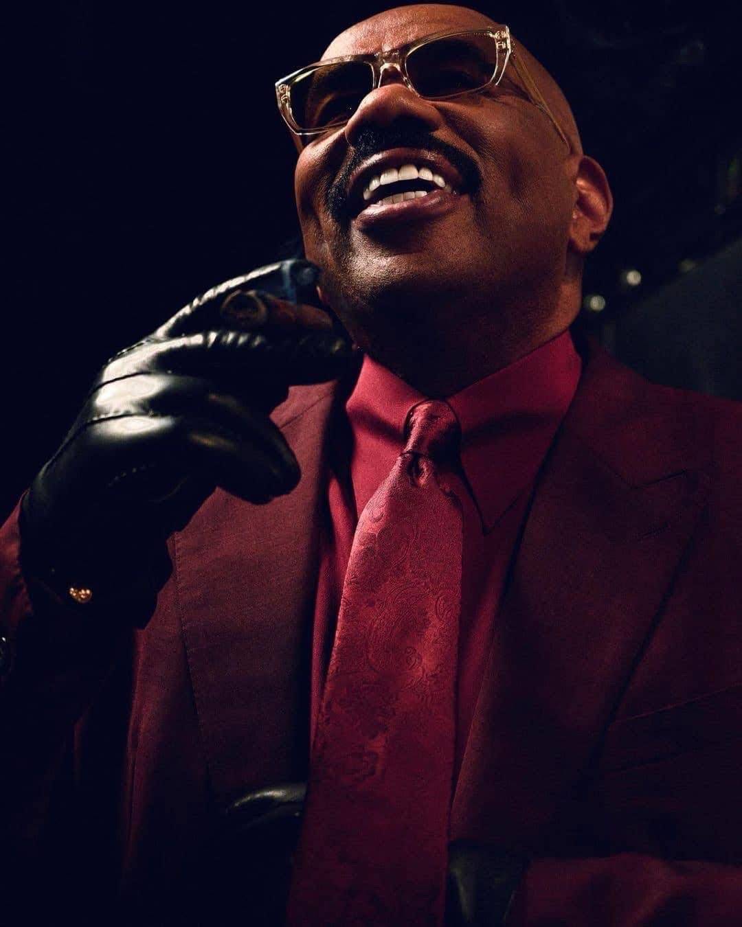 A post by @steveharvey on TikTok caption: 🔍 Story behind the outfit:  Y’all see this right here? This ain’t just a suit—it’s a statement. This burgundy right here say, I’ve been through the fire, came out clean, and now I’m sittin’ at the table I built. cause even when life tried to knock me down, God said, “Get back up. I ain’t done with you yet.” #B#BossEnergyS#SteveHarveyStyleB#BuiltNotBoughtM#MensStyleO#OGStatusH#HarveyWisdomS#SuitedAndRootedT#TikTokMotivationSharpDressedMan #steveharvey 