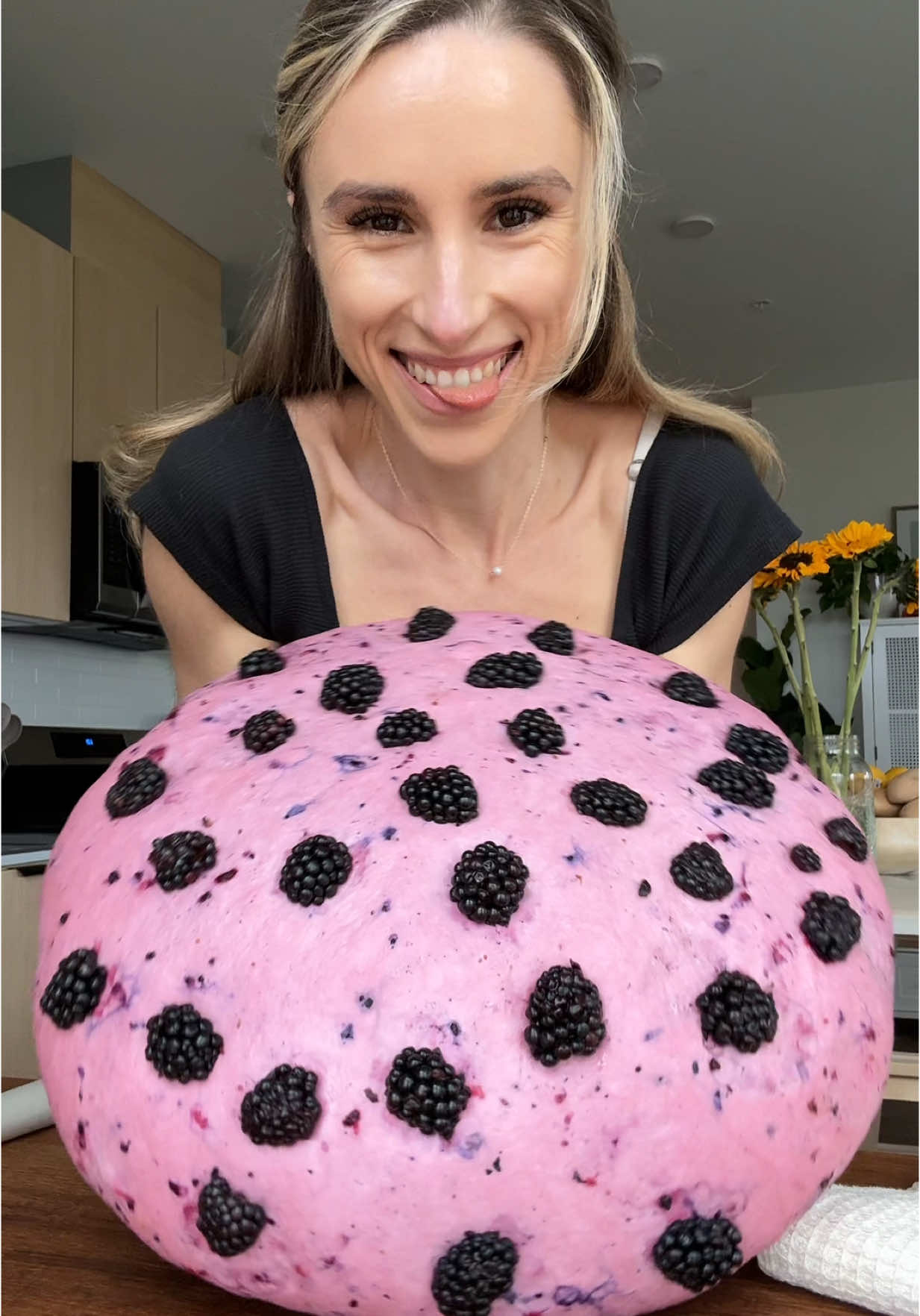 A post by @jeshastevens on TikTok caption: Blackberry bagels AND homemade honeycomb cream cheese 🌸🖤 #bagel #sourdough #baking #bagels #breakfast 