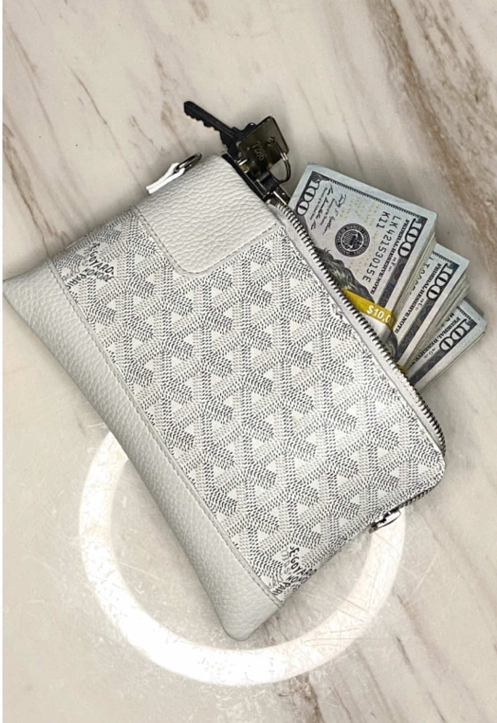 A post by @sheronbarber on TikTok caption: Client: I need a small bag that can hold 50 stacks for when I’m out. Me: Say Less