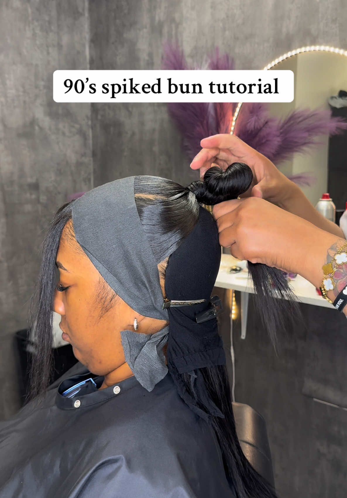 A post by @donesharenae on TikTok caption: 90’s spiked bun tutorial 🥰🫶🏽💕 #ClevelandHairstylist #HalfUphalfDown #SleepPonytail #sleekpony 