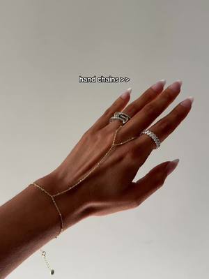 A post by @_whitneygoodman on TikTok caption: @PAVOI to say I’m obsessed w/ your jewelry pieces is an understatement 😍✨ affordable and such good quality!  #foryou #jewelry #handchain #affordablejewelry #creatorsearchinsights 