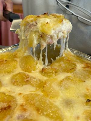 A post by @giallolovesitaly on TikTok caption: 💛@nonnasilviofficial's potato parmigiana is pure comfort in every bite!🤤 Creamy béchamel, melty cheese, and layers of goodness you’ll crave again and again🧀🍽️ Ingredients: 2.2 lbs potatoes (1 kg) 7 oz cooked ham, sliced (200 g) 1 cup shredded scamorza or mozzarella cheese (250 g) 2 cups grated cheese, such as Parmesan (200 g) Extra virgin olive oil, as needed Salt and pepper, to taste For the homemade béchamel sauce: ⅓ cup butter (80 g) ½ cup all-purpose flour (80 g) 4 cups whole milk (1 liter) Nutmeg, to taste Salt, to taste #giallolovesitaly #parmigiana #potatoes #foodtok
