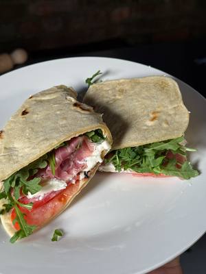 A post by @giallolovesitaly on TikTok caption: Soft, warm, and ready to wrap around anything🧂🥖 This Italian flatbread is giving major piadina vibes!🔥 Just flour, water, oil (or lard), and love💛✨ @chefmarco_nyc Ingredients: 3 cups all-purpose flour (375g) ¾ cup water (185ml) 3 tablespoons extra virgin olive oil or 3 tablespoons lard (40g) 1 teaspoon salt (6g) #giallolovesitaly #flatbread #foodtok