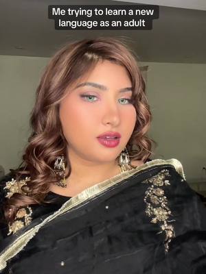 A post by @babewtv3r on TikTok caption: #desitiktok @DanakataPori is my daily motivation to go on #girltok #hindi #curls #blacksuit #bengalitiktok 