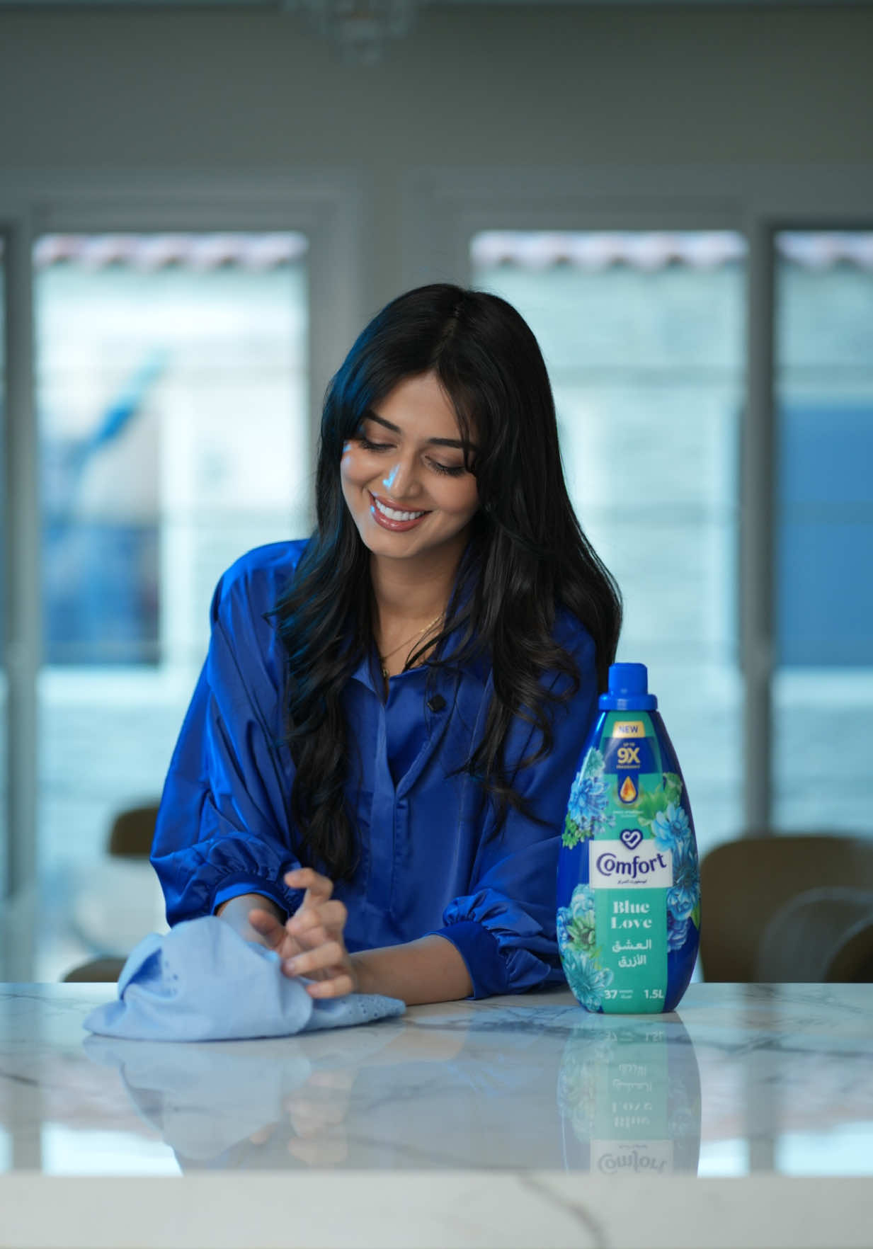 A post by @jumana on TikTok caption: Ready for a fragrance that just won't quit? 🤔 I only trust my clothes with blue love 💙 from @Comfort Arabia  There’s nothing like stepping into clothes that feel fresh, look crisp, and smell amazing — wash after wash and for days!! Experience the irresistible freshness for yourself. ✨ and let me know your thoughts 💭  #ComfortArabia #BlueLove 
