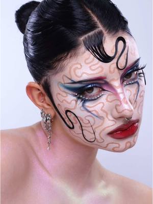 A post by @runscay on TikTok caption: recreating @Lavanya Wiles ‘s peel off makeup trick using @Mehron Makeup liquid latex, @KVD Vegan Beauty good apple serum foundation and a loose pearl pigment 🎀🌸 #creativemakeup #liquidlatex #peeloffmask 