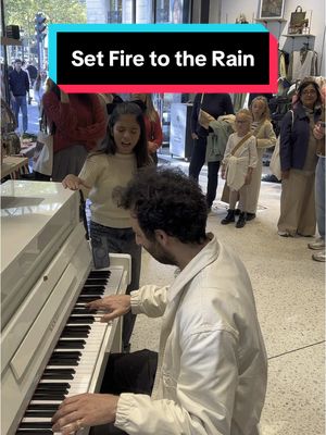 A post by @juliencohen_piano on TikTok caption: This little girl asked me to play Set Fire to the Rain… and then SHOCKED the whole supermarket 😮 With @Victoria Nicole 