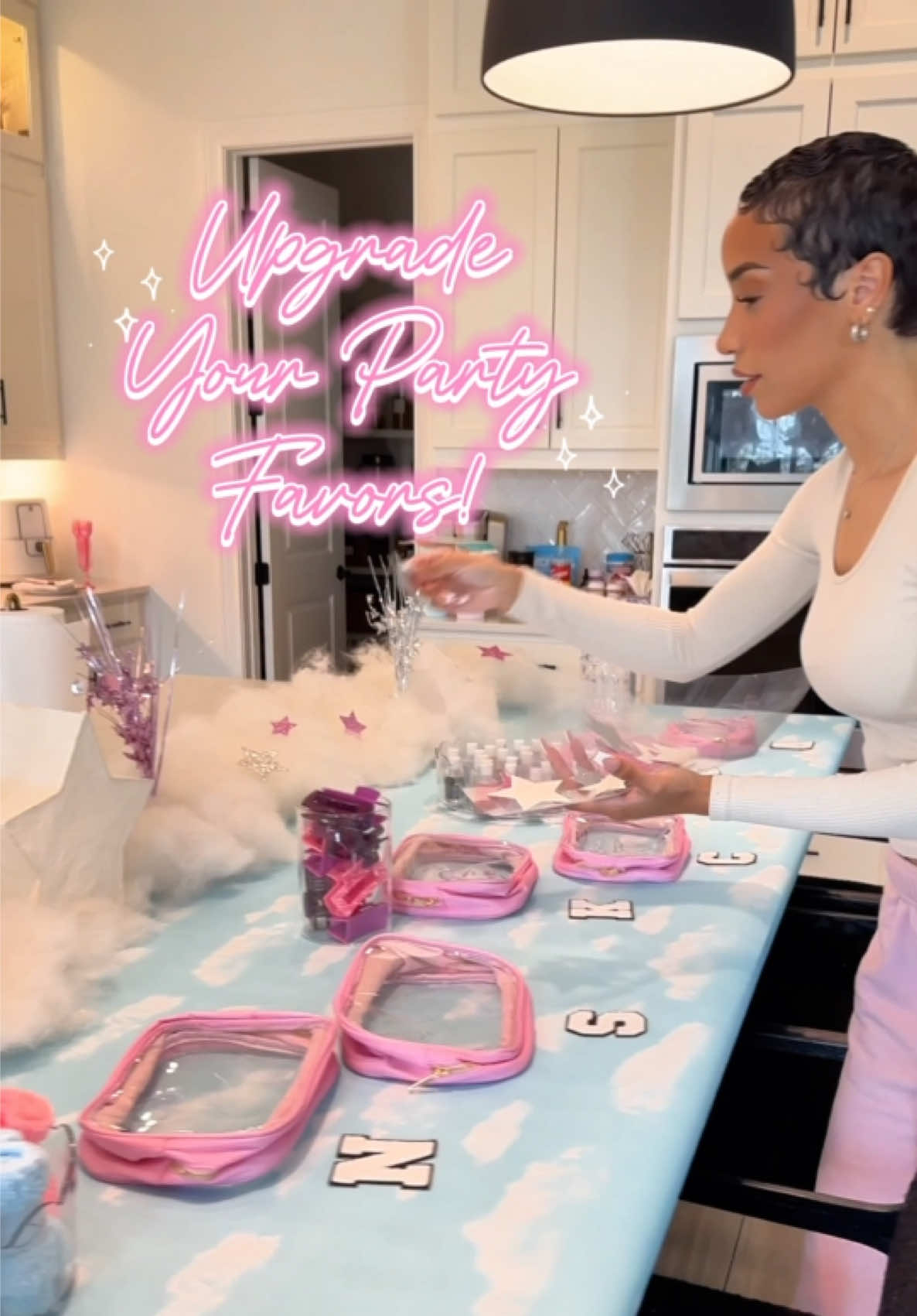 A post by @ravenelysetv on TikTok caption: We don’t do “throw away” party favors around here! Just know when you come to my house, you’re leaving with something good! ☁️✨ If you’re gonna spend the energy and money on party favors, might as well do it right! Right? What do y’all think? Too extra?? 👀🤷🏽‍♀️ #diypartydecor #kidspartyfavors #kidspartyideas #slumberpartyideas #cloud9party #littlegirlsparty