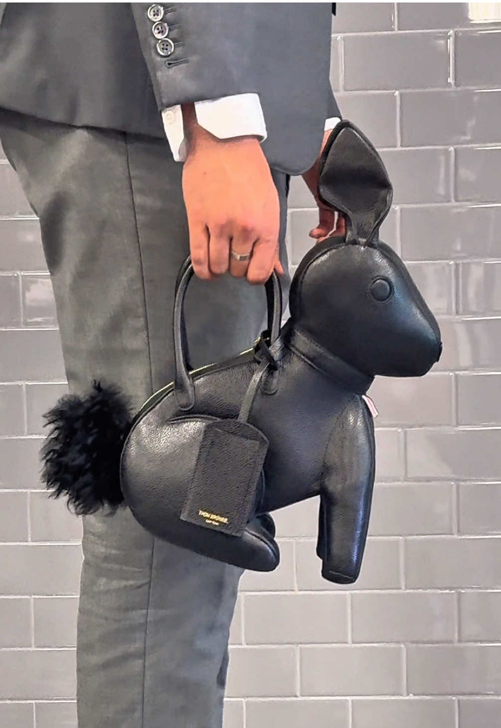 A post by @miamidesigndistrict on TikTok caption: Playful, polished, and perfect for spring. Hop into the season with Thom Browne’s Rabbit Bag—part of their Animal Icon collection.  #MiamiDesignDistrict