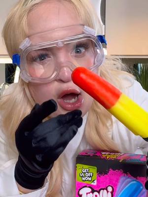 A post by @laurengodwin on TikTok caption: Not sure how @Trolli pulled this off. Lowkey addicted. #trolligummipop #trolli #tastetest #ad