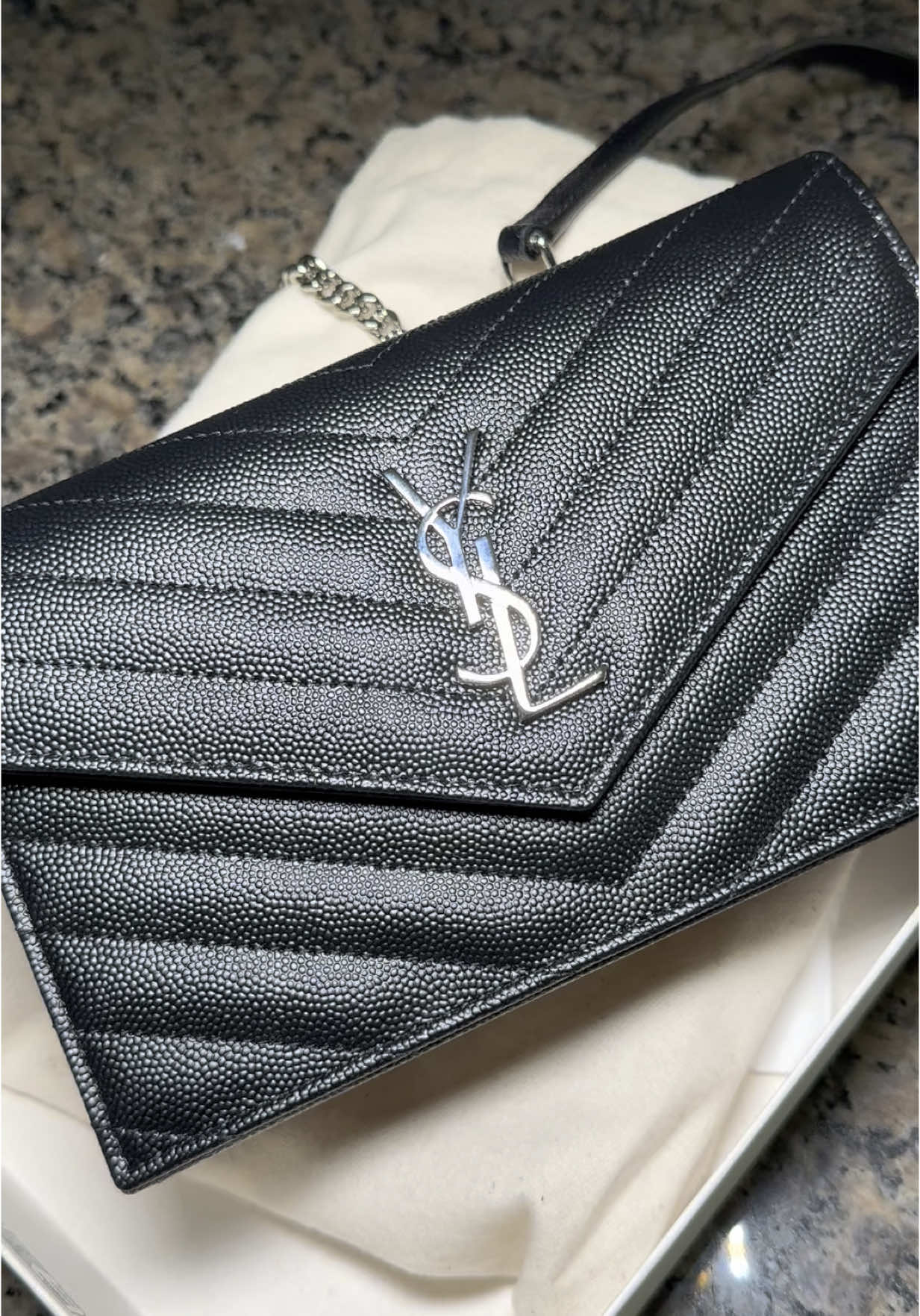 A post by @shaneeceanyco on TikTok caption: I loveee 🫶🏽 #unboxwithme #unboxing #luxuryunboxing #luxurybag #yslbag 
