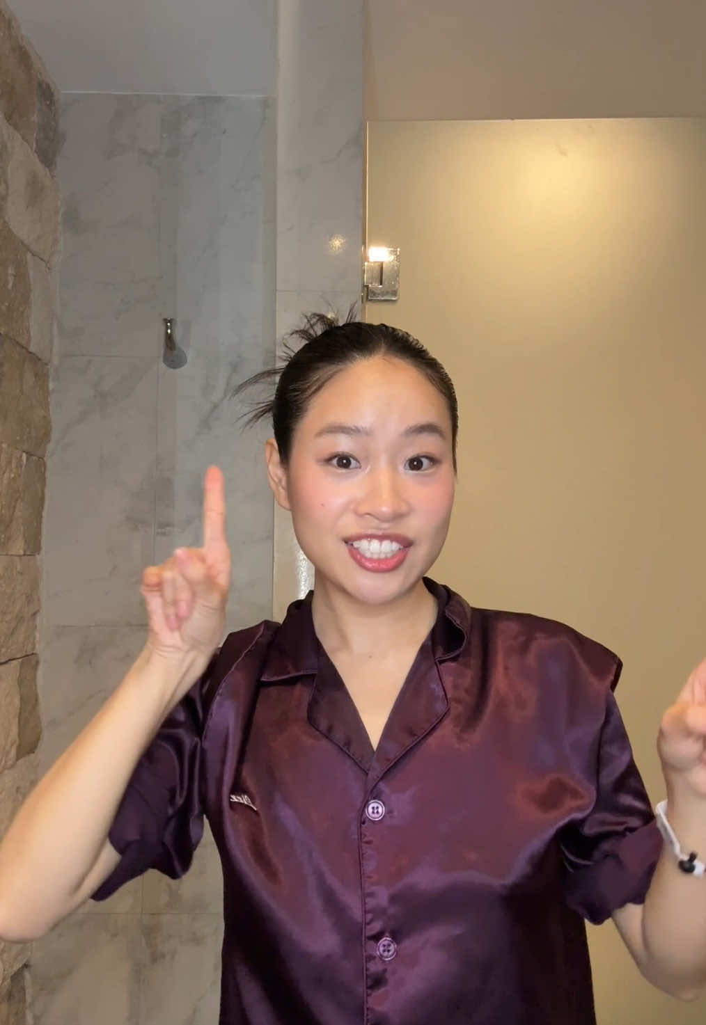 A post by @lizzymwong on TikTok caption: The back of my hair is none of my business 😅 #grwm #dinner #easyhairstyles #slickbackbun 