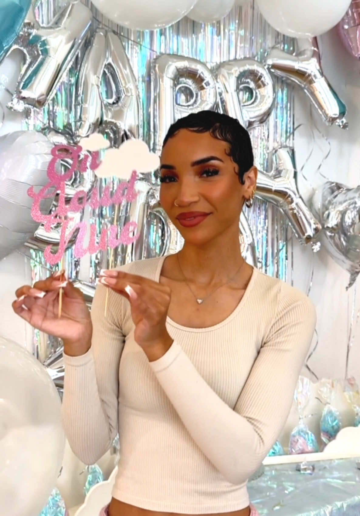 A post by @ravenelysetv on TikTok caption: Finishing touches for Ziya’s ☁️Cloud 9☁️ party! I made a simple DIY cake topper, some fun cloudy balloons, and I just had to do cotton candy! So cute! ✨ #diypartydecor #cloud9party #kidspartyideas #slumberpartyideas #diycaketopper #cloudballoons
