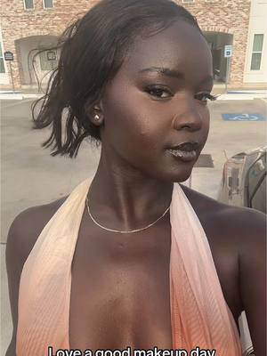 A post by @missslado on TikTok caption: A time was hadddd 🤩🤩  #makeup #mightout #darkskinmakeup #blackgirlmagic 