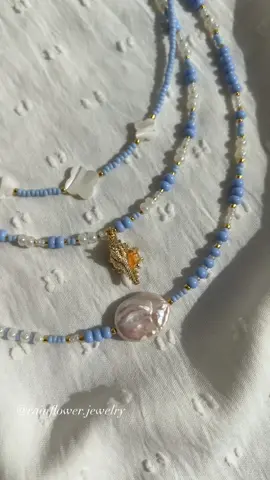 A post by @rainflower.jewelry on TikTok caption: I'm in love with this sky blue bead and pearl combo🥹🐚🌊💫Now available in my shop with free worldwide shipping🤍 #beadedbracelet #skyblueaesthetic #pearljewelry #floralbracelet #handmadejewelry #springstyle #bohojewelry #daintyaccessories #bracelettok #fyp #trendingjewelry #shopsmall #supporthandmade #freeworldwideshipping 