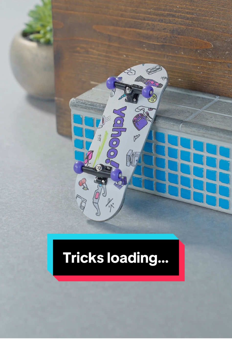 A post by @stonedboarder on TikTok caption: New tricks with @Yahoo 🔥🛹 #yahoopartner #fingerboard #fingerskate #fingerboarding #skatelife 