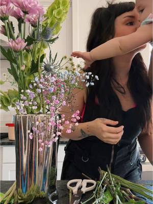 A post by @ashxlevi on TikTok caption: me & my chaos bouquet for spring 🫶🏼
