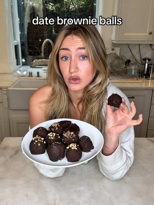 A post by @katiefarhood on TikTok caption: 🍫chocolate date brownie balls🍫 these are a new weekly rotation for me, they satisfy my late night sweet cravings right away and they’re made of such simple ingredients!  @elle gibson I owe you my LIFE for creating this recipe I am so obsessed!  It is definitely one of those recipes that I eyeball but here’s the measurements if needed:  1 1/2 cups pitted dates 2-3 tbsp almond or oat flour 3 tbs cacao powder 1 scoop protein powder (I skipped this and added more almond flour) 2 tbs honey 2 tbsp almond or peanut butter  splash of vanilla big pinch of salt blend until it becomes a sticky dough, cover in chocolate, and set in the fridge! they’re my favorite when they’re stuffed with rice crispies 🤤 #healthydessert #lowsugardessert #lowcaloriedessert #healthydesserts #healthybrownies