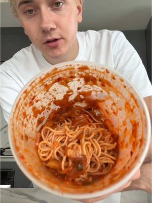 A post by @logagm on TikTok caption: One container spicy cold kimchi noodles (bibimguksu) kbbq video on my ig! 🪺