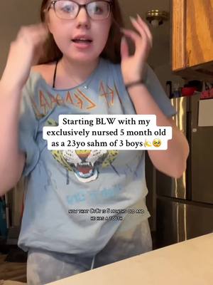 A post by @thebramleyfamily__main on TikTok caption: This video is a couple weeks old… he has 2 teeth now😭 also yes Finnie got a banana🤣  #MomsofTikTok #sahmsoftiktok #marriedat18 #momof3boys #5monthspostpartum #blw #blwideas #bananas #5montholdbaby 