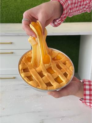 A post by @gtcreationslime on TikTok caption: We're cooking up something SWEET with slime! Watch us create the perfect SLIME Apple Pie using our Apple Pie Cooking Kit, packed with satisfying textures and cozy fall vibes.   Now available on our website! grab yours at www.gtcreationslime.shop and make your own slice of squishy heaven! 🍏 