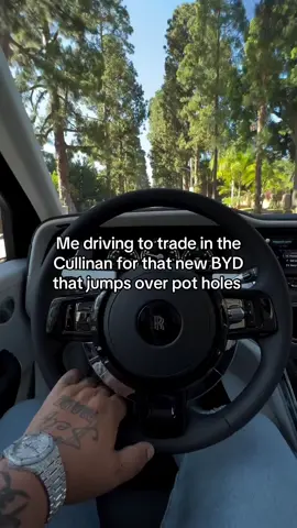 A post by @sheronbarber on TikTok caption: Headed to trade in the Cullinan for the new BYD that jumps over pot holes.